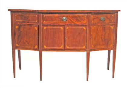 Appraisal: Federal inlaid mahogany sideboardThe shaped rectangular top with three long