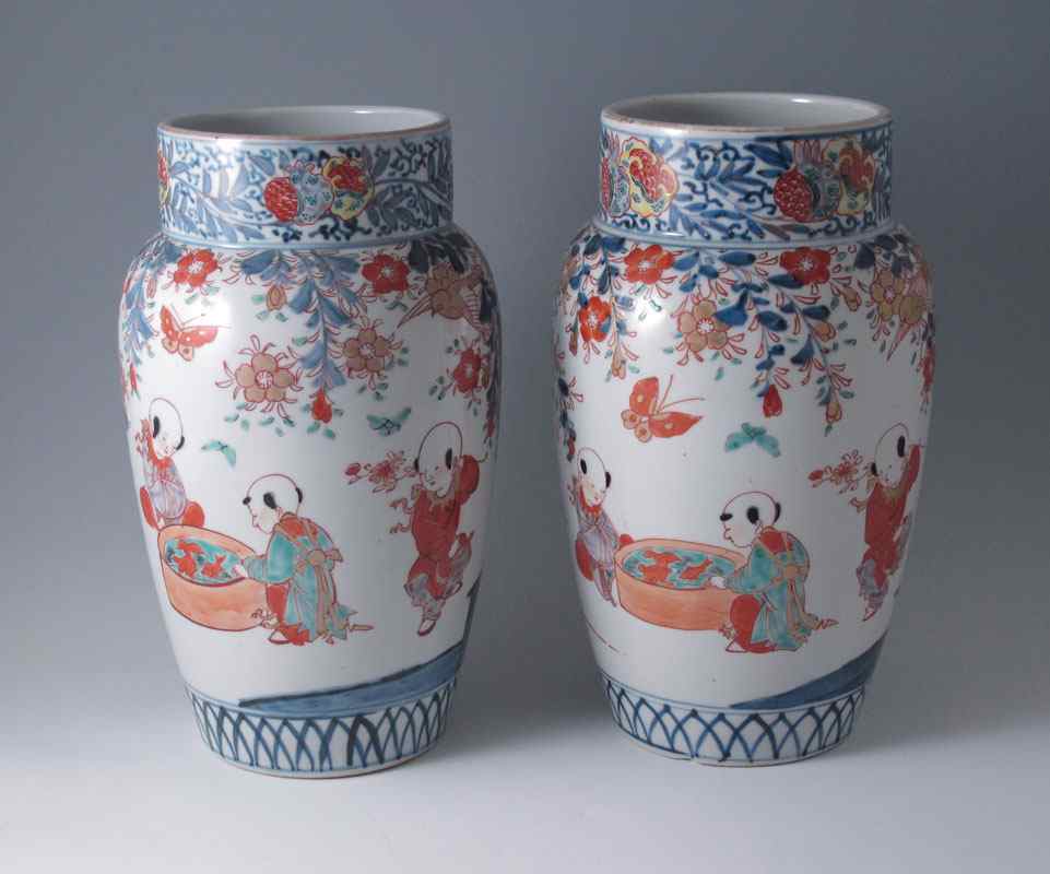 Appraisal: PAIR OF JAPANESE IMARI VASES Featuring scene of children at