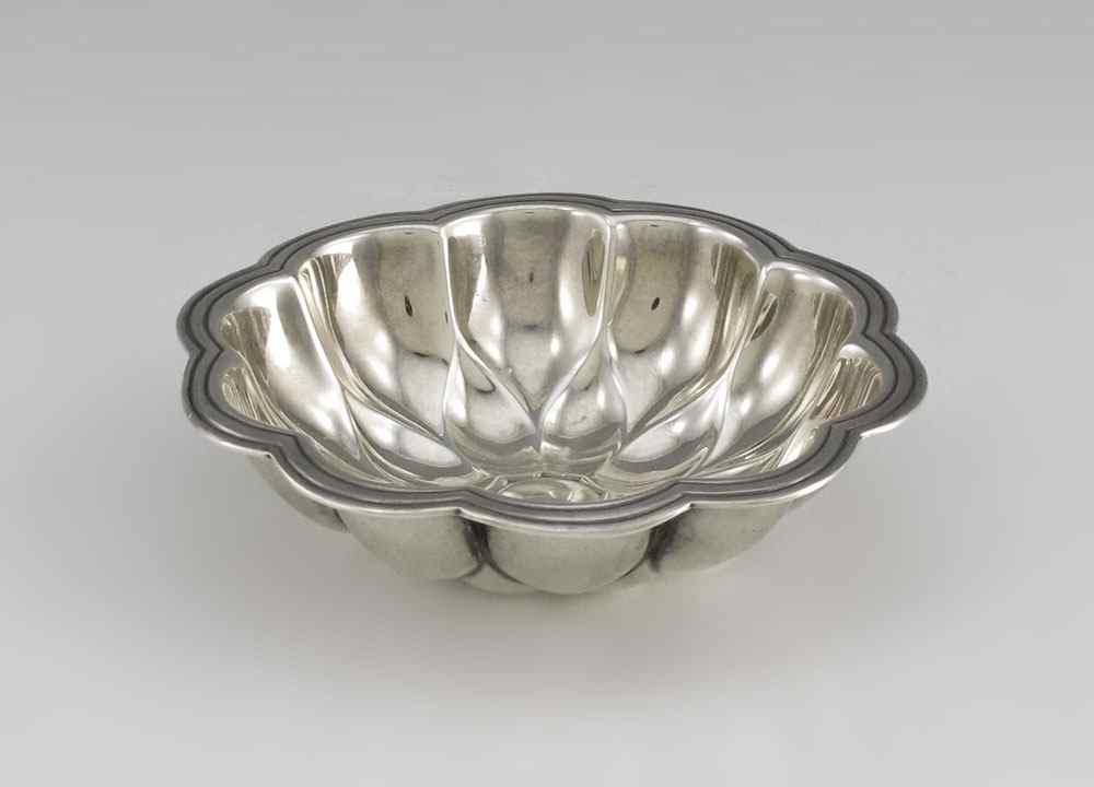 Appraisal: TIFFANY CO STERLING SILVER NUT DISH Floral form with scalloped