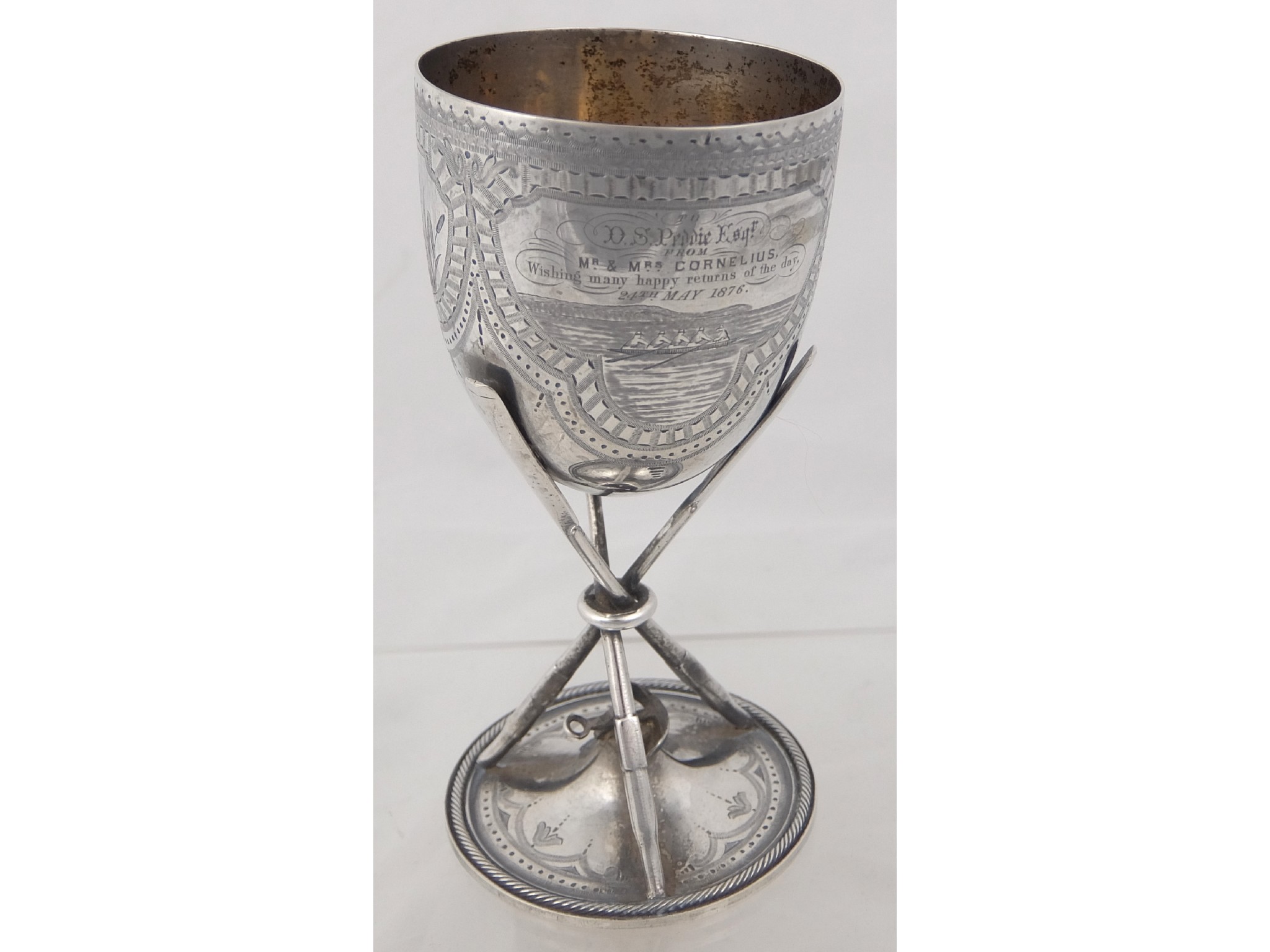 Appraisal: A white metal goblet with rowing and sailing motifthe tapering