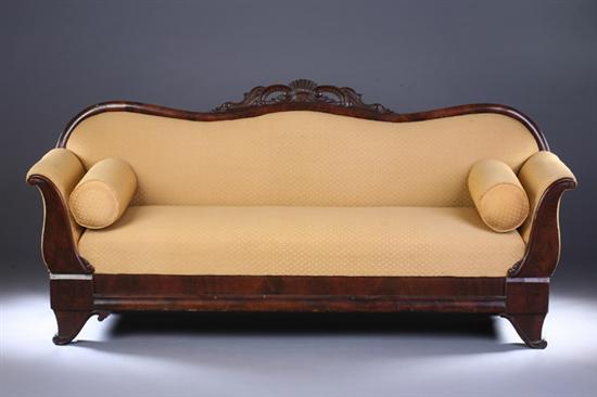 Appraisal: ROCOCO REVIVAL CARVED WALNUT SERPENTINE SOFA th century with gold