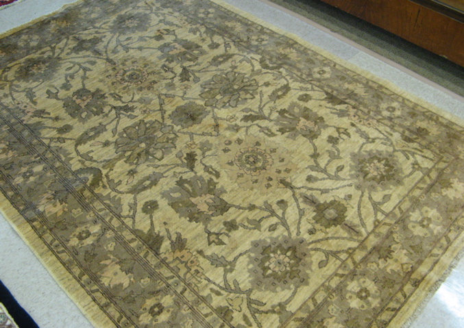 Appraisal: HAND KNOTTED ORIENTAL CARPET Pakistani Zeigler overall floral design on