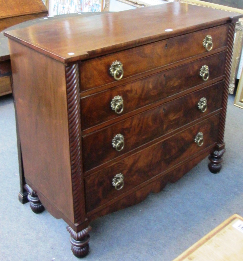 Appraisal: A Regency mahogany chest of four long graduated drawers with