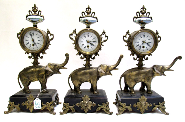 Appraisal: SET OF THREE FIGURAL ELEPHANT CLOCKS gilt metal elephant raising