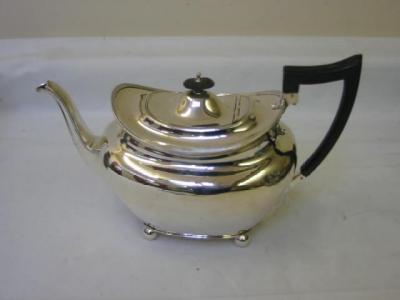 Appraisal: A TEAPOT of oval baluster form the domed lid with