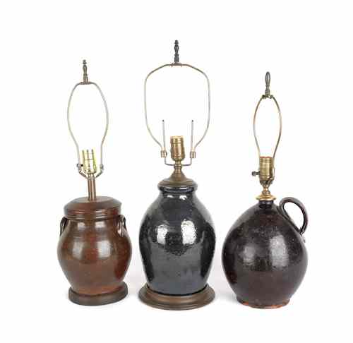 Appraisal: Three redware crocks ca converted to electric table lamps