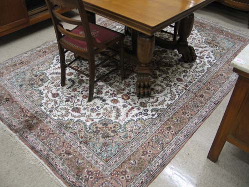 Appraisal: HAND KNOTTED SINO-PERSIAN CARPET floral and floral medallion design on