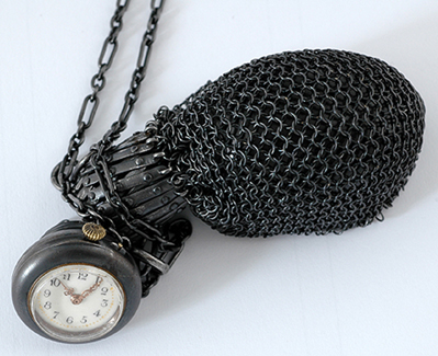 Appraisal: A gun metal purse with pocket watch clasp The gun