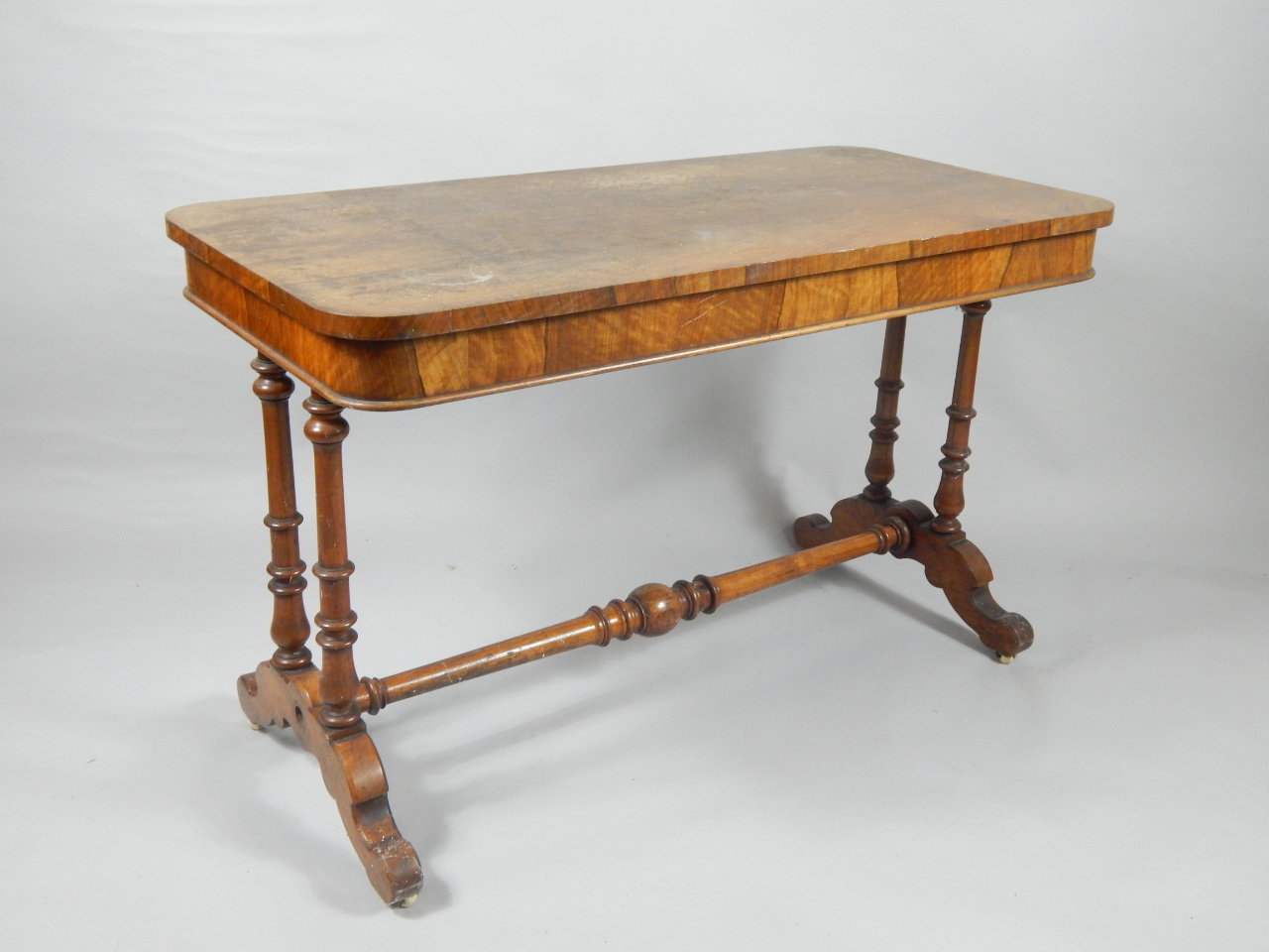 Appraisal: A Victorian walnut library table the rectangular top with two