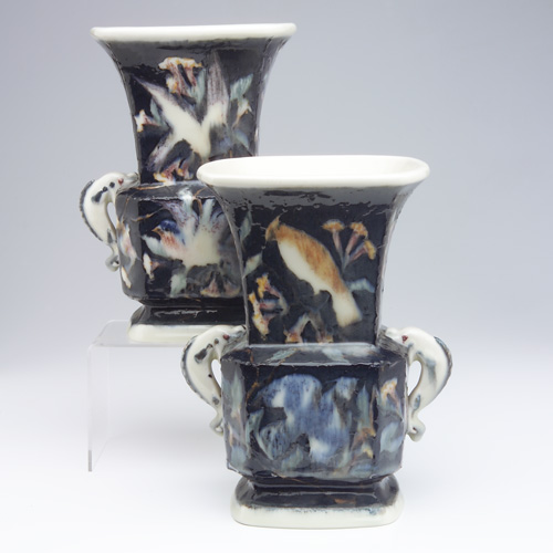 Appraisal: ROOKWOOD Pair of tall Jewel Porcelain urns with dolphin handles