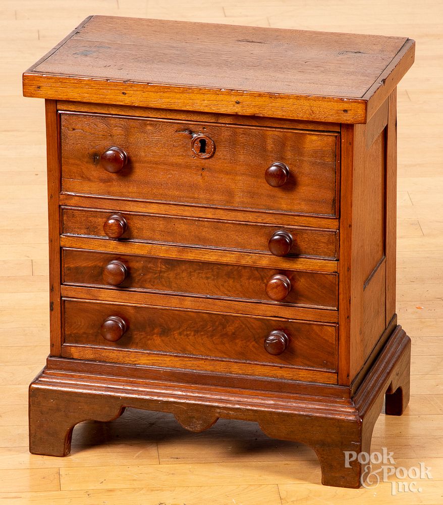 Appraisal: Miniature walnut chest of drawers th c Miniature walnut chest