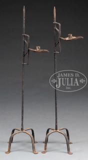 Appraisal: RARE PAIR OF ADJUSTABLE FORGED IRON CANDLESTANDS th century American