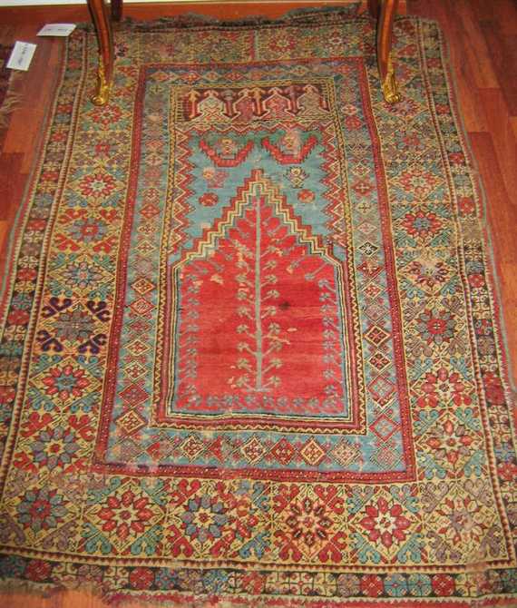 Appraisal: TRANSYLVANIA antique Red mihrab with a tree of life and