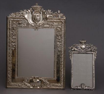 Appraisal: CONTINENTAL SILVER PICTURE FRAME AND A LARGER SILVER-PLATED FRAMED MIRROR