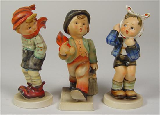 Appraisal: Three Hummel Figurines Boy in winter wind boy with umbrella