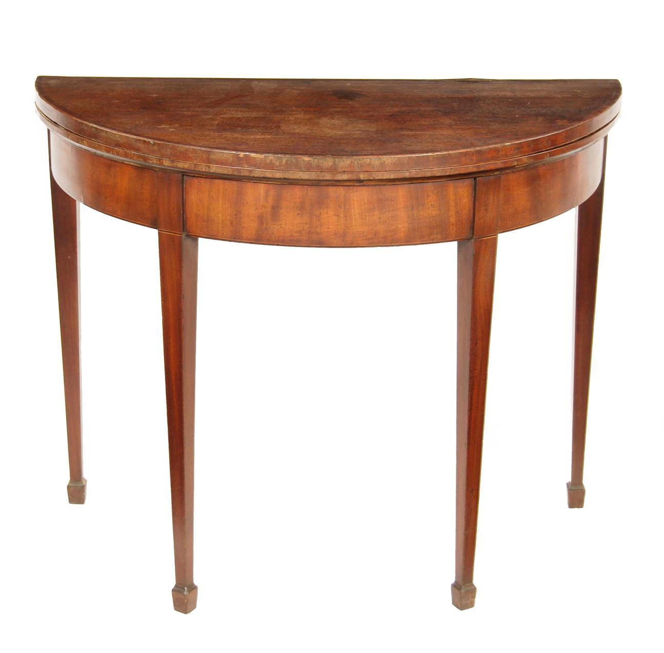 Appraisal: A th century mahogany demi-lune card table