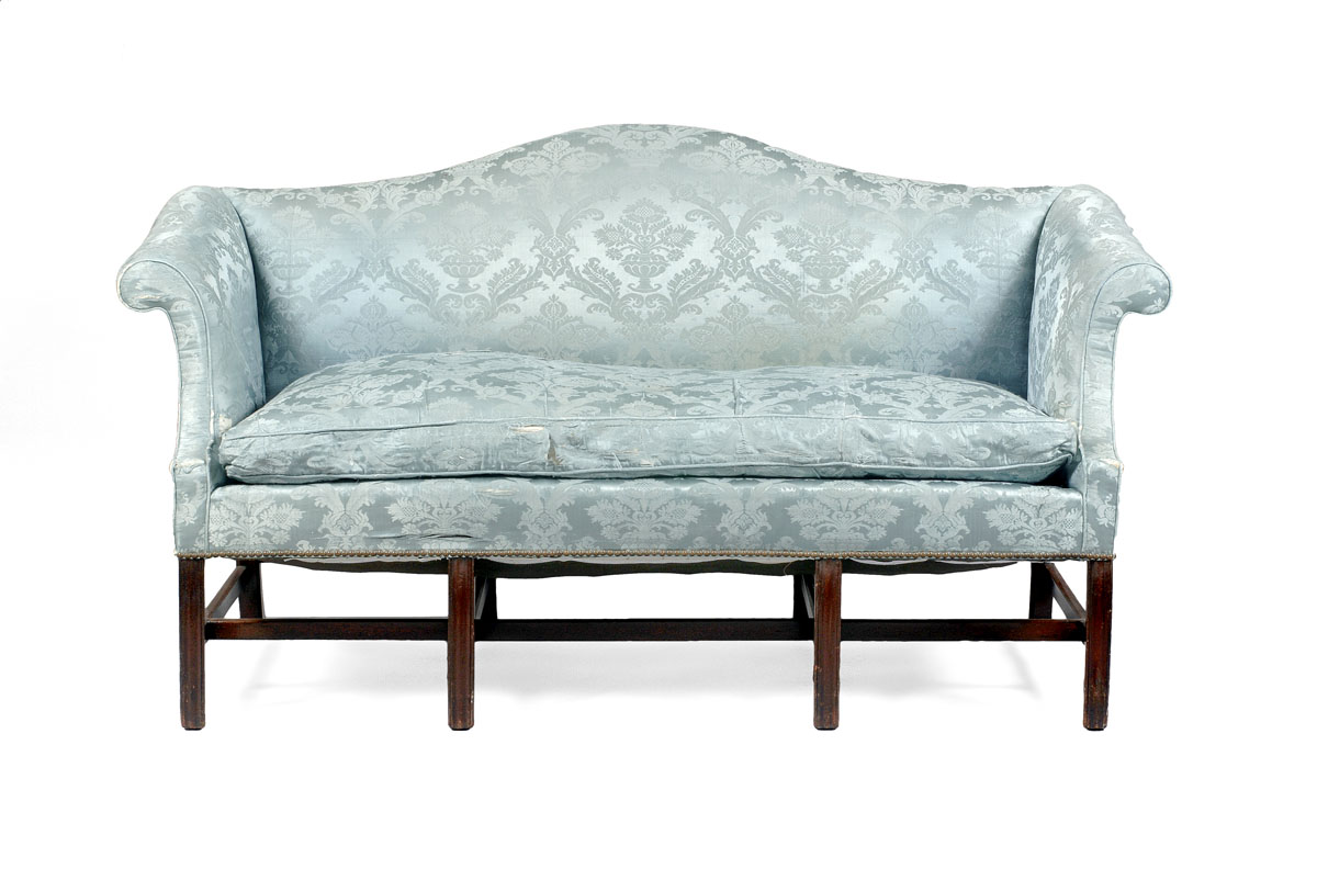 Appraisal: CHIPPENDALE MAHOGANY CAMELBACK SOFA AMERICAN OR ENGLISH The upholstered serpentine