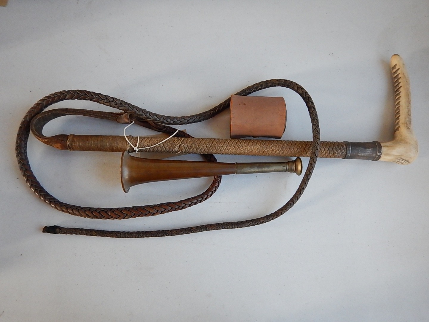 Appraisal: A huntsman's leather bound whip with silver mount and presentation