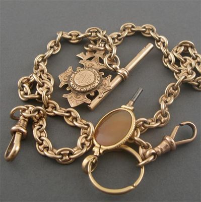 Appraisal: A gold anchor link Albert watch chain with gold medallion