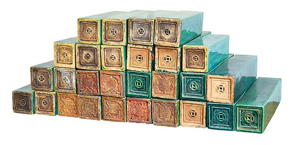 Appraisal: A COLLECTION OF CHINESE GREEN GLAZED EARTHENWARE TILE MOULDS various