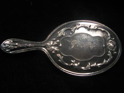 Appraisal: Lady's silver mirror Petite silver mirror engraved Jimmy in floral