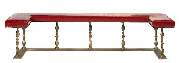 Appraisal: An English brass and upholstered club fender height in width