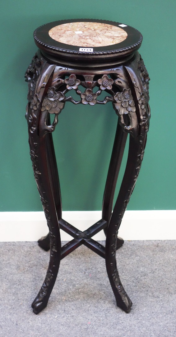 Appraisal: A th century Chinese urn stand the circular marble inset