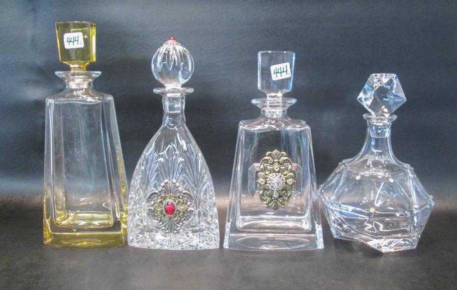 Appraisal: FOUR CRYSTAL DECANTERS three by Ann Cichon Dallas and with