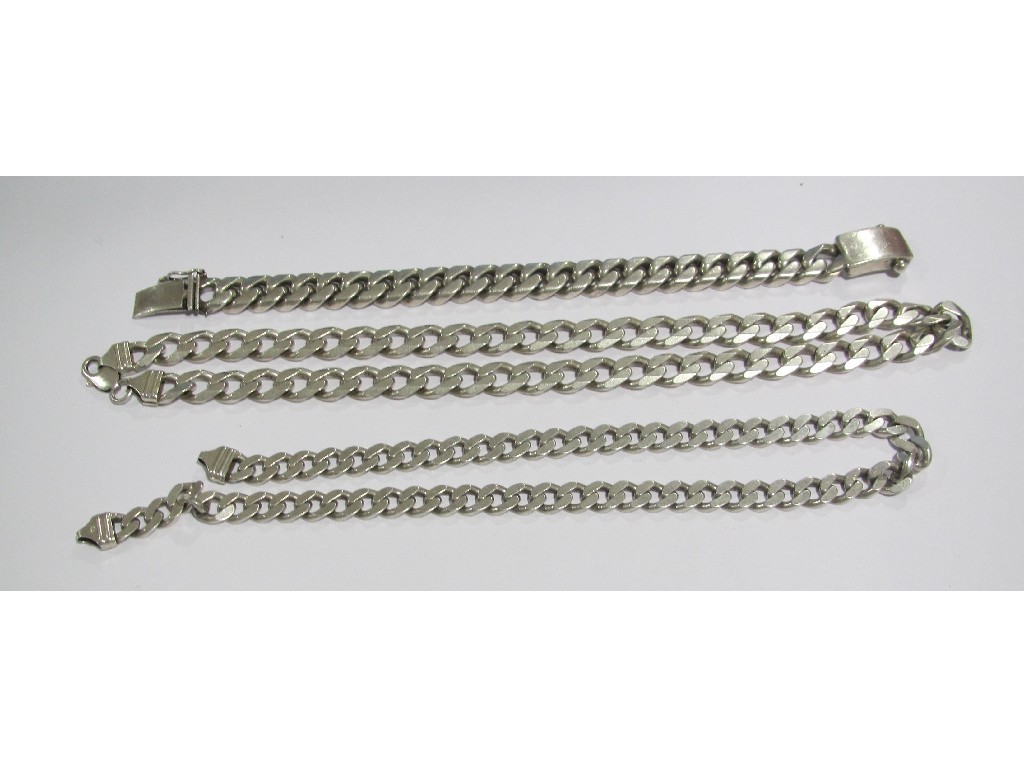 Appraisal: Two flat curb link silver necklaces and a bracelet