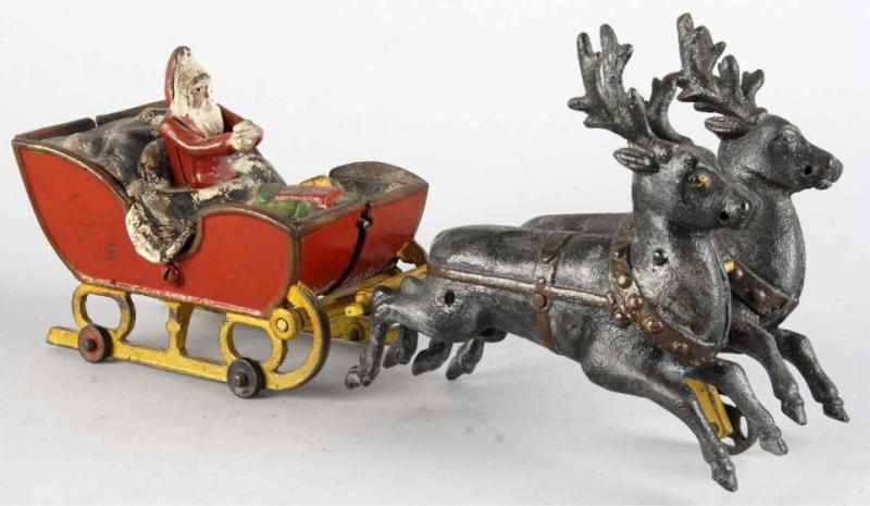 Appraisal: Cast Iron Kyser Rex Santa Claus Sleigh Toy Description American