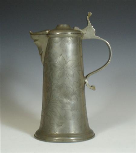 Appraisal: An th century Continental pewter flagon with foliate wrigglework decoration