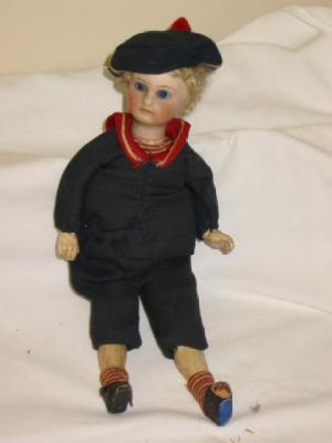 Appraisal: A Belton bisque head boy doll with fixed blue glass