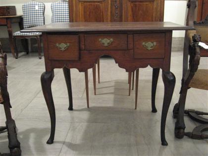 Appraisal: George II walnut dressing table th century The rectangular molded