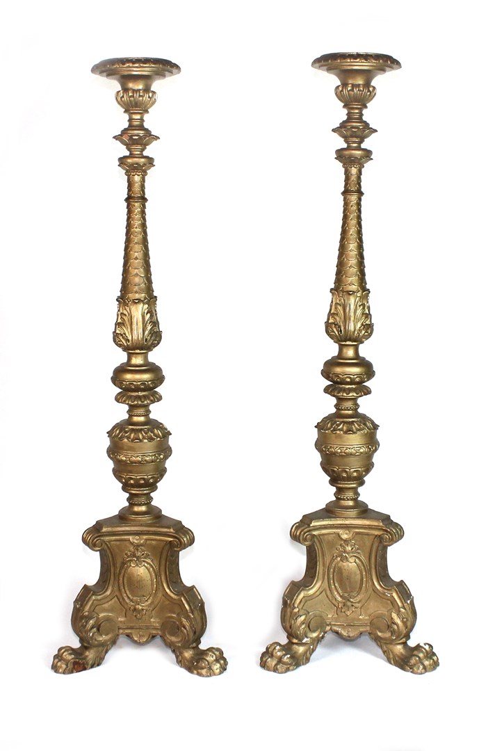 Appraisal: A pair of gilt torcheres each with scale carved column