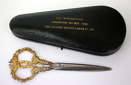 Appraisal: A PAIR OF SILVER MOUNTED STEEL SCISSORS in a leather