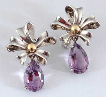 Appraisal: A pair of silver gold and amethyst drop earrings by