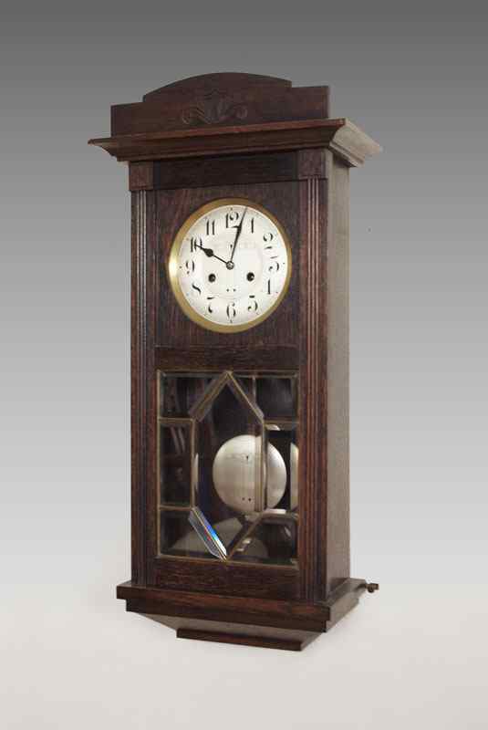 Appraisal: JUNGHANS GERMAN WALL CLOCK Wood case with beveled leaded glass