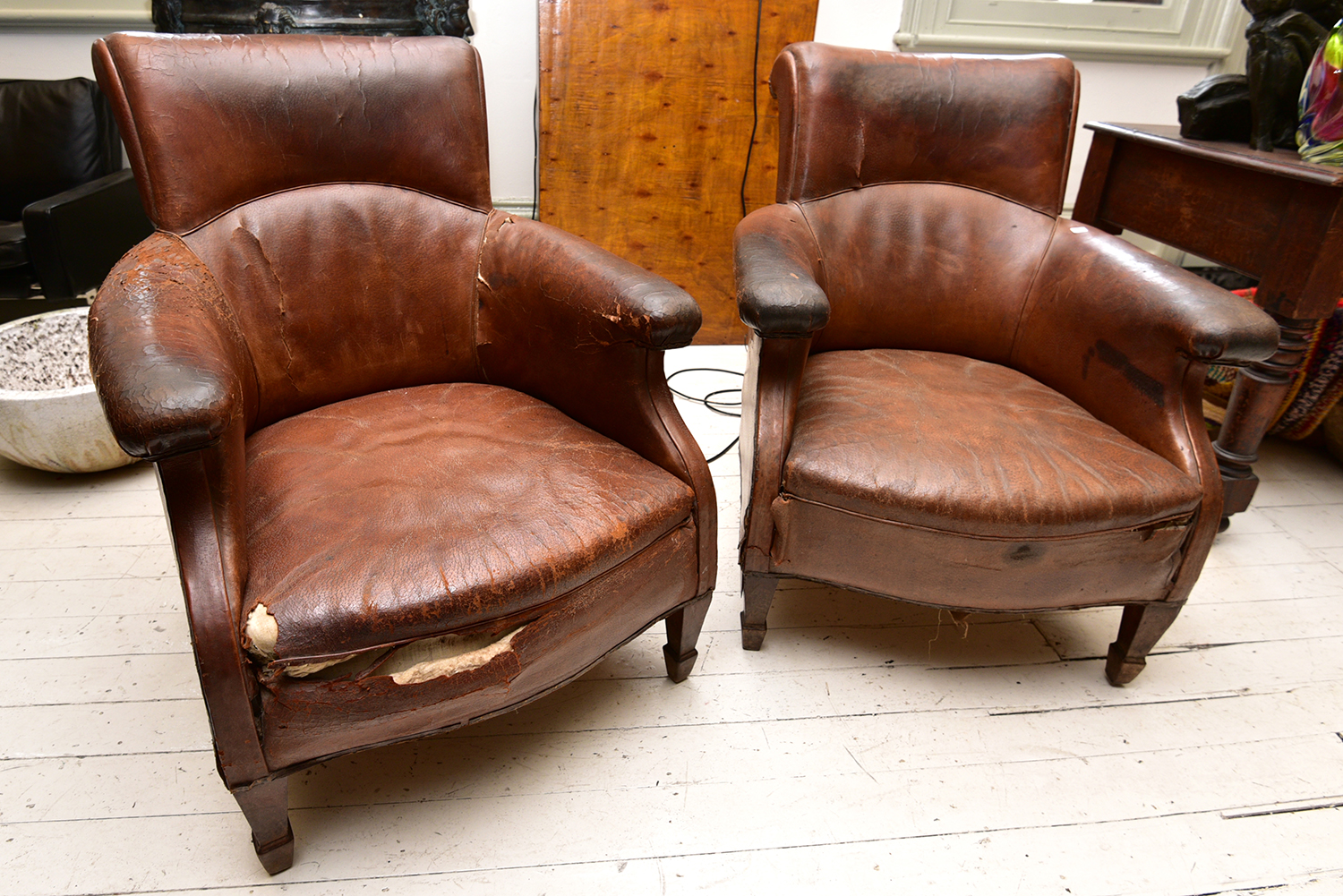 Appraisal: A PAIR OF EARLY TH CENTURY FRENCH ARMCHAIRS IN DISTRESSED