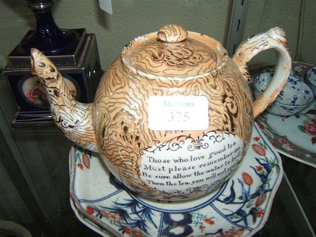 Appraisal: A Victorian glazed pottery teapot with motto AF