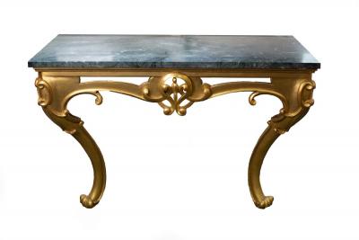 Appraisal: A th Century marble topped console table on scroll carved