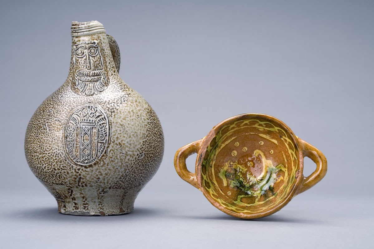 Appraisal: NEVERS REDWARE SLIP-DECORATED TWO-HANDLED DISH The spherical bowl decorated on