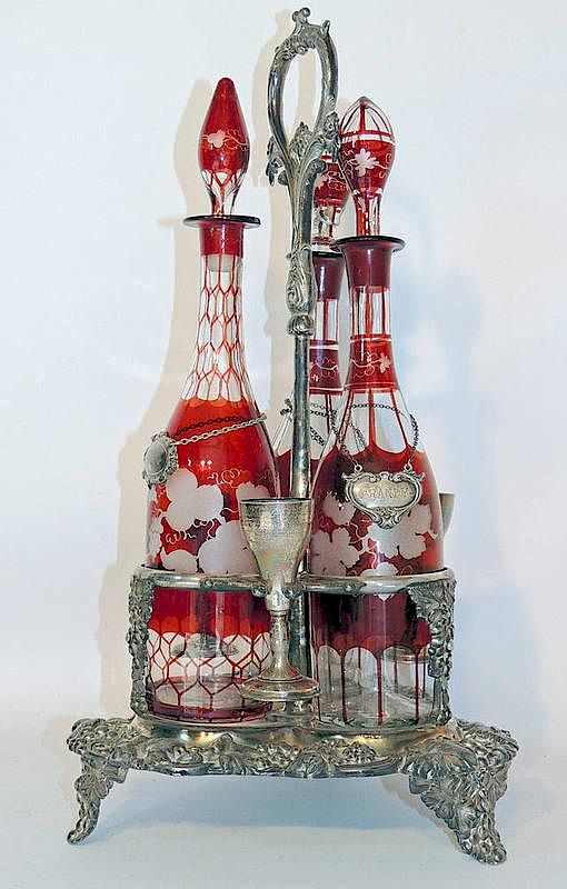 Appraisal: Glass and Silver Plate Decanter Set With three - tall