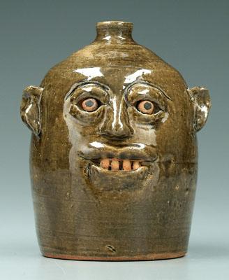 Appraisal: Reggie Meaders face jug Hall County Georgia born ceramic eyes