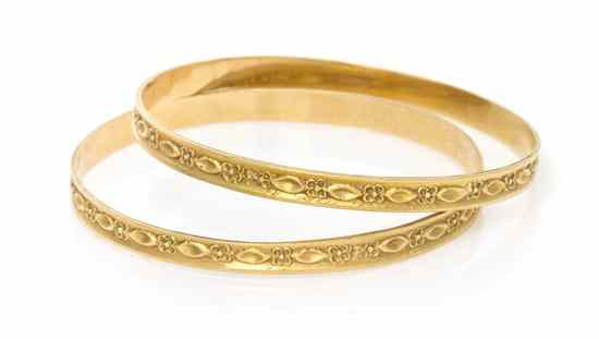 Appraisal: A Pair of Karat Yellow Gold Bangle Bracelets measuring approximately