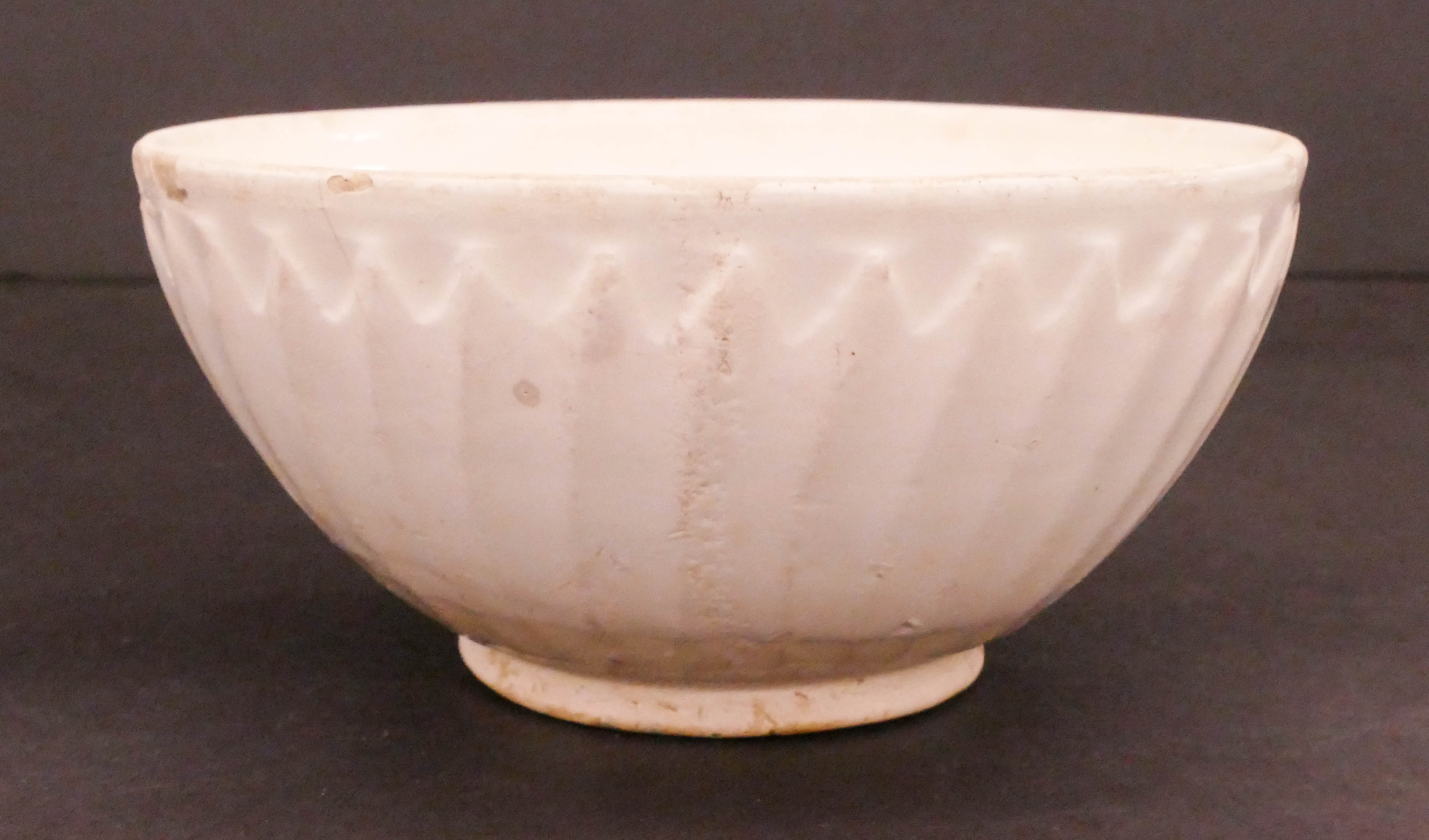 Appraisal: Chinese Song White Glazed Lotus Bowl ''x '' Molded lotus