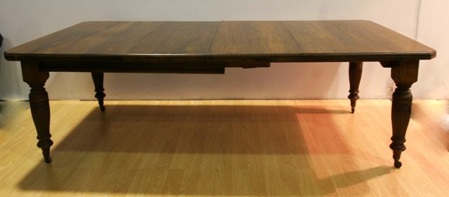 Appraisal: An Edwardian style stained beech dining table with two leaves