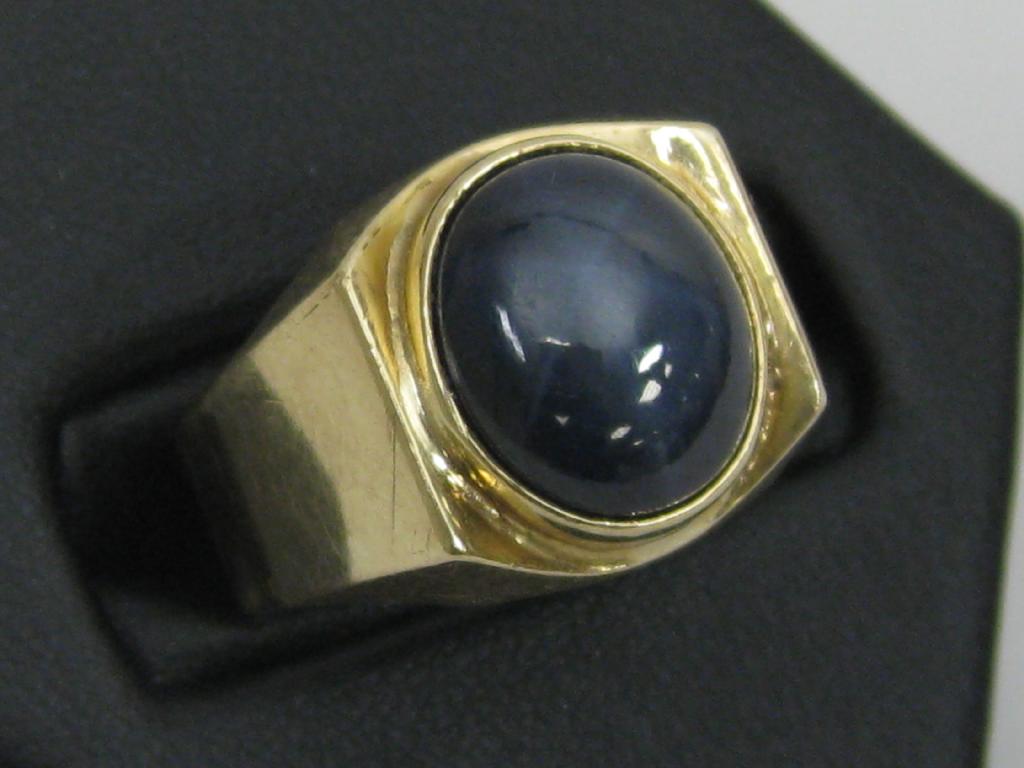 Appraisal: A Gentleman's possibly synthetic Star Sapphire Ring the oval cabochon