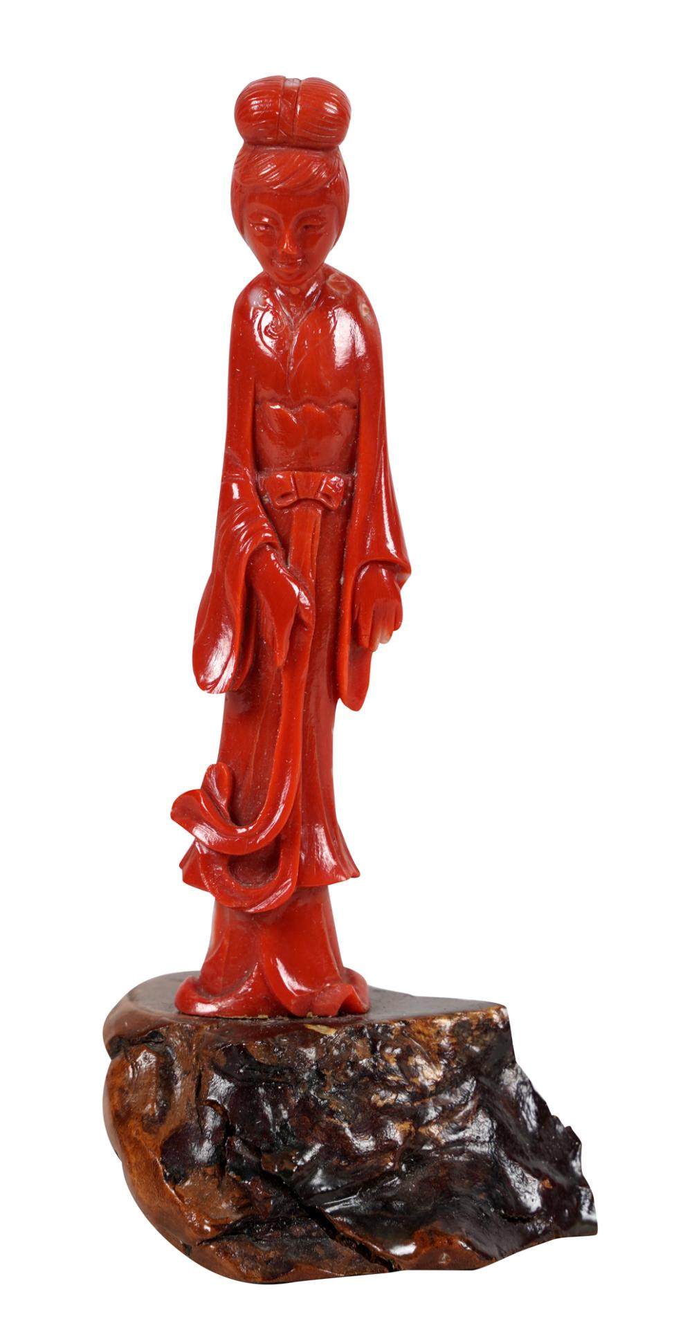 Appraisal: CARVED CORAL GUAN YINon wooden base the figure inches high