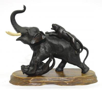 Appraisal: A JAPANESE BRONZE FIGURE modelled as an elephant fighting two