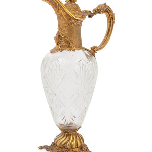 Appraisal: A Gilt Metal Mounted Cut Glass Claret Jug Early th